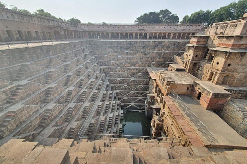 A large, ancient stepped structure with multiple levels and a central water feature. 2