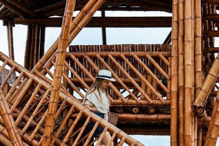 A person climbing a bamboo staircase. 5
