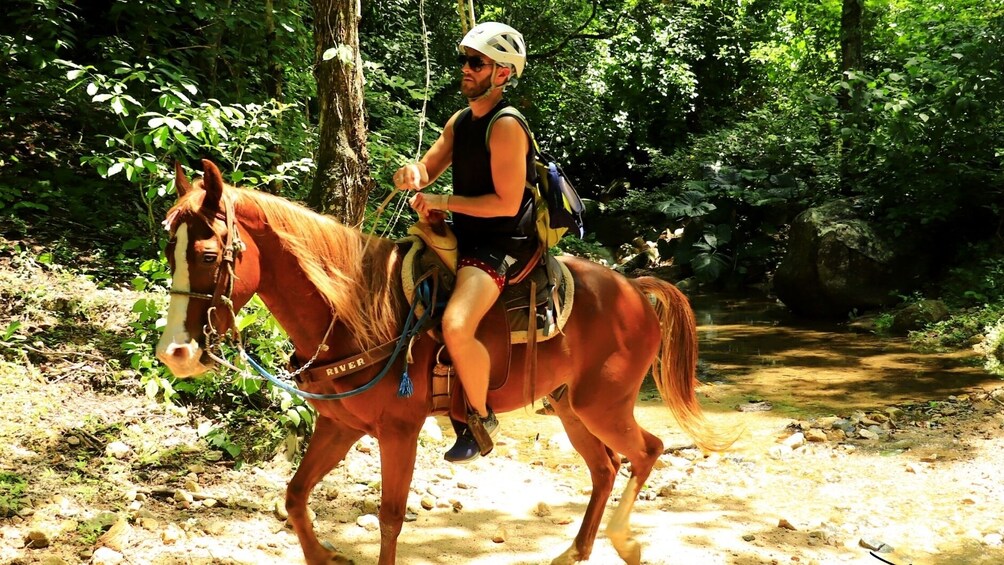 Man riding a horse at Sierra Madre Mountain