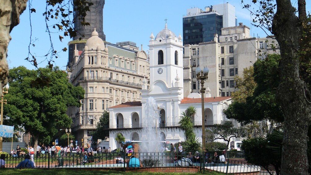 walking by a white church in the city in Argentina