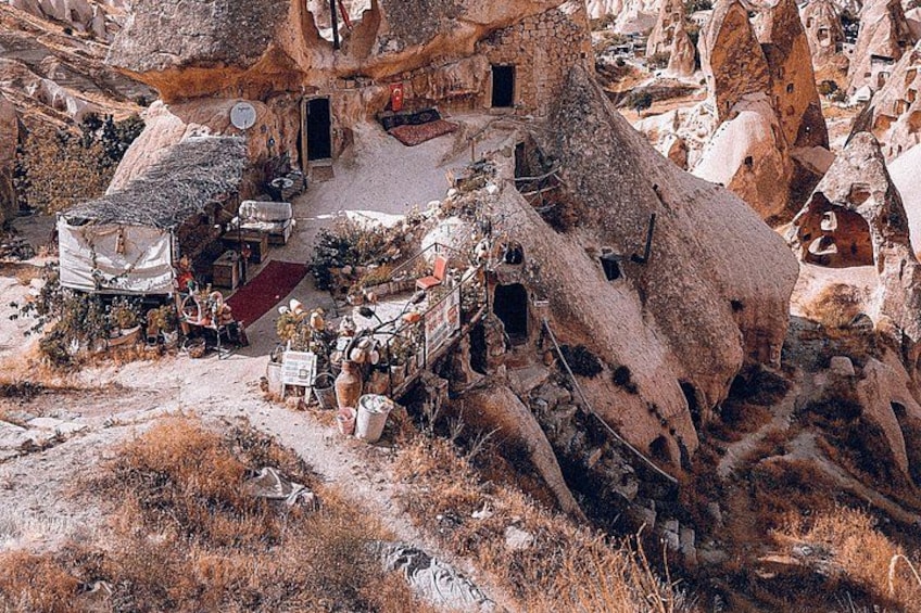 A rocky landscape with a large, hollowed-out rock formation. 4
