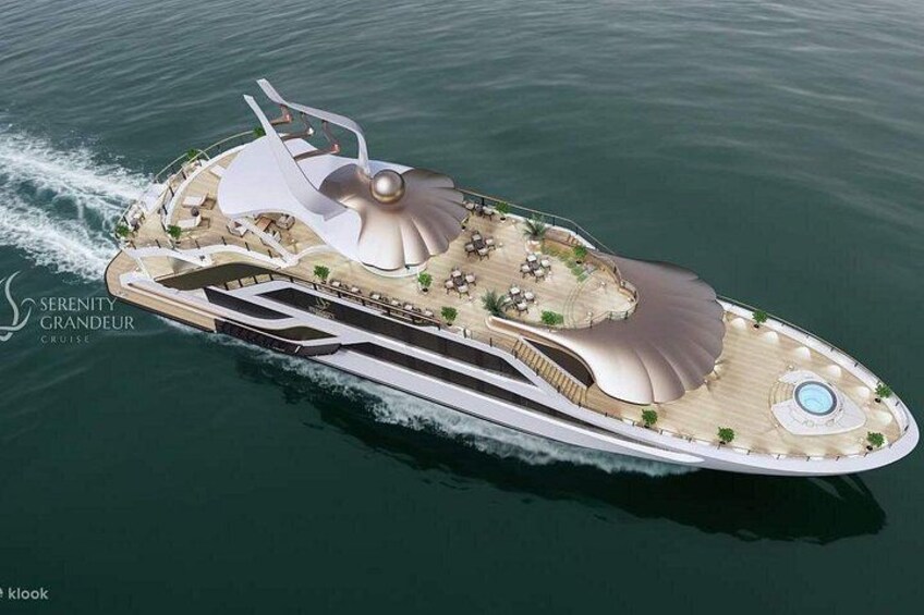 A luxury yacht with a spacious deck, a swimming pool, and a distinctive design. 1
