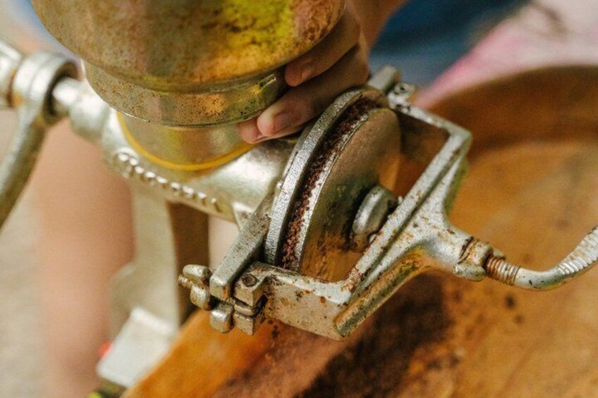 A close-up of a rusty metal object, possibly a part of machinery, with a hand holding it. 3