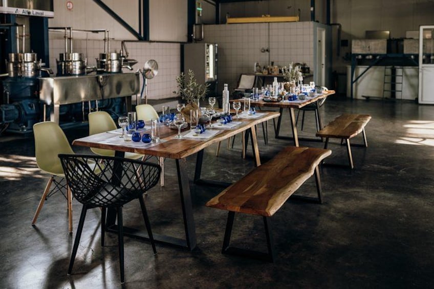 A dining area with wooden tables, chairs, and benches. 3
