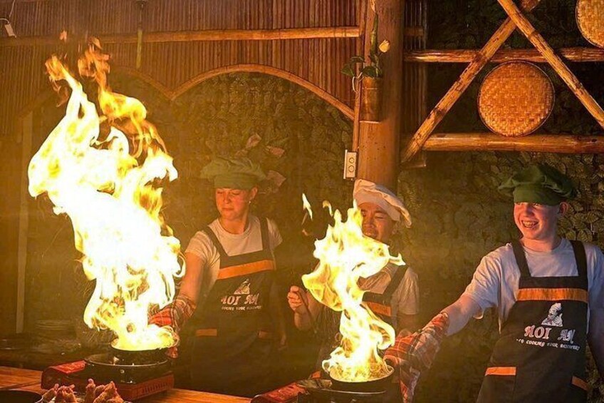 Chefs performing fire tricks with flames. 2