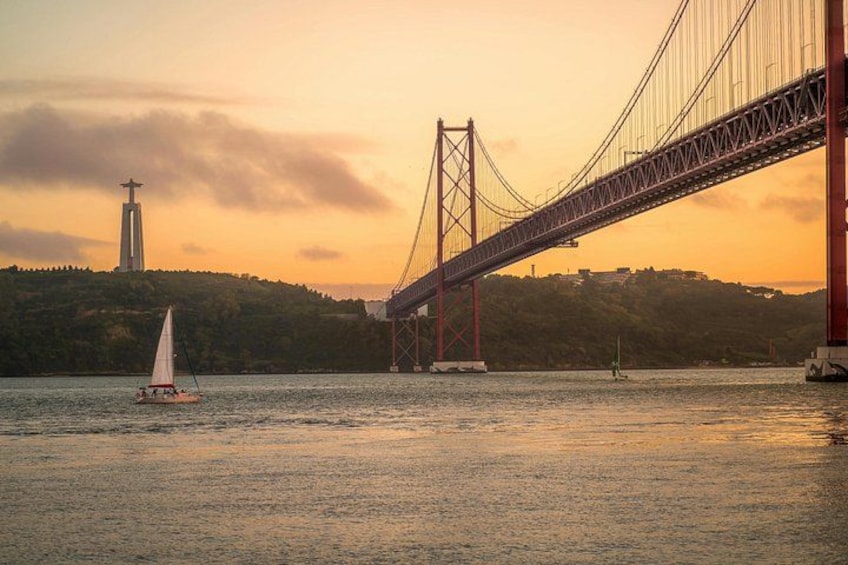 A bridge, a sailboat, and a lighthouse. 4