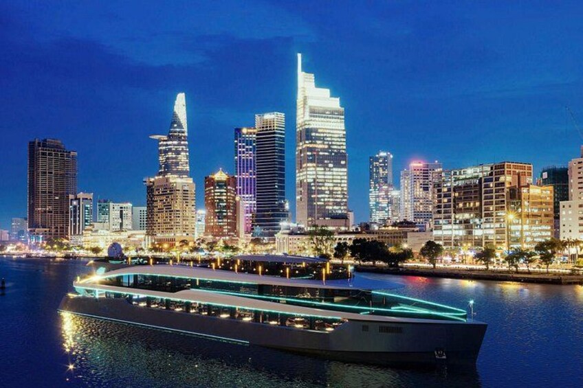 Een verlichte stadshemel bij nacht, met gebouwen en een rivier. 5