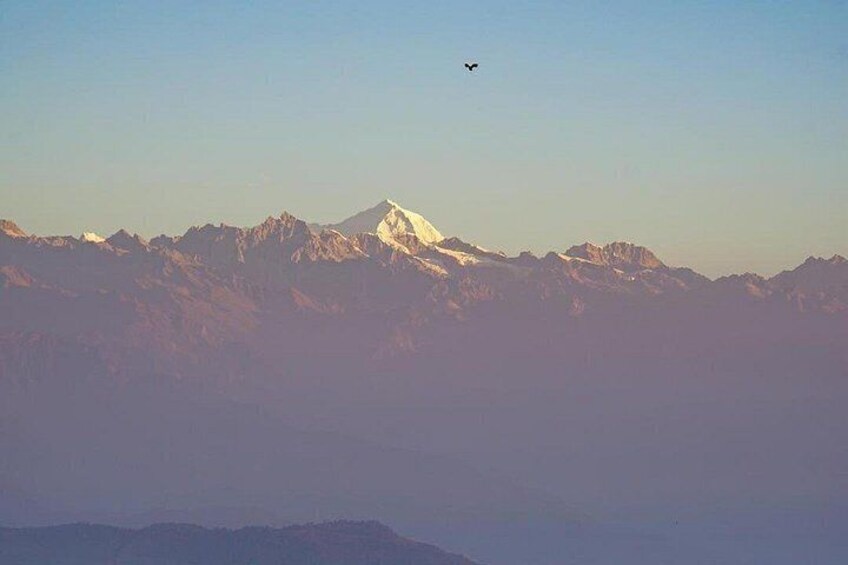 A mountain range with a plane flying above. 3