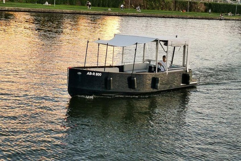 A narrowboat named AB-R 800 on a calm river. 4