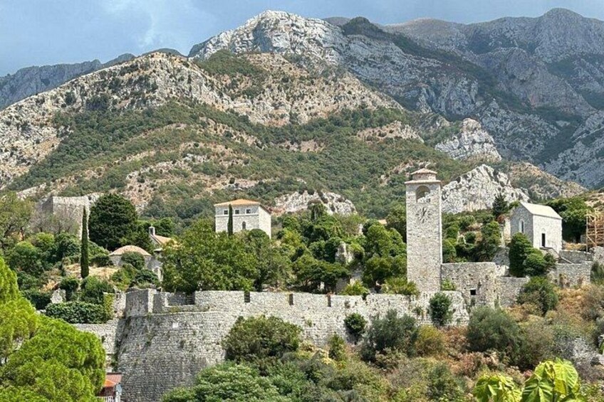 A mountainous landscape with ancient ruins and stone walls. 2