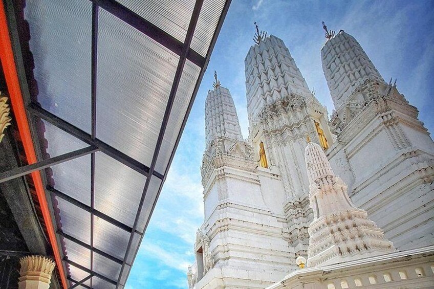 A temple with multiple spires and intricate carvings. 3