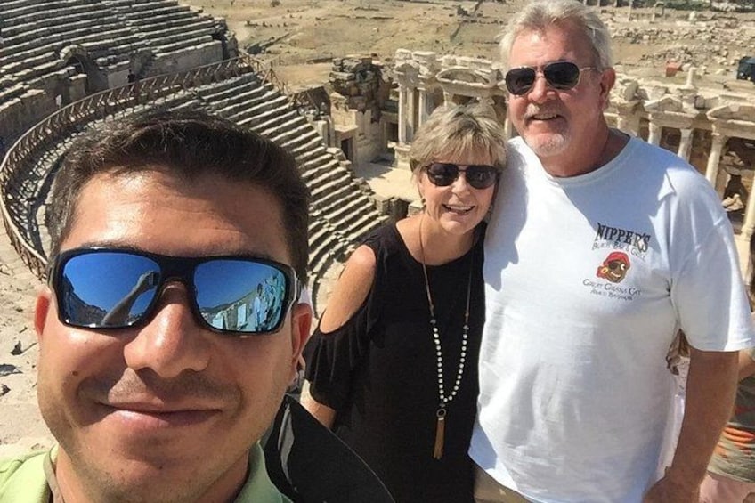 A historical site with ancient ruins and a partially intact amphitheater. 5