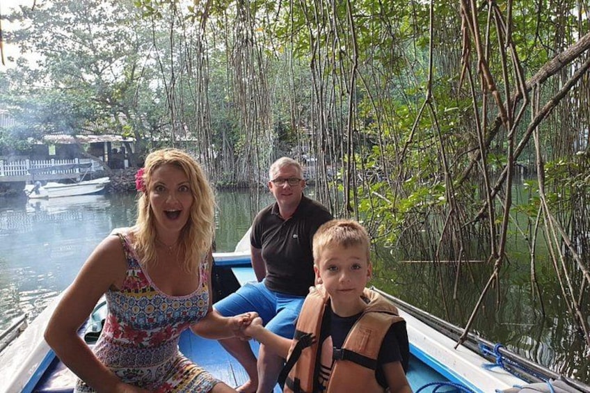A boat on a river surrounded by trees. 3
