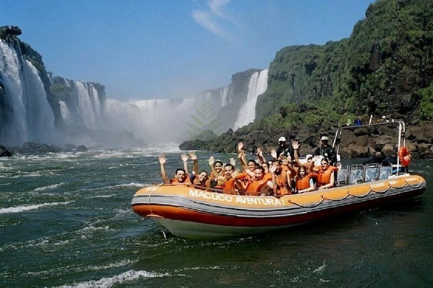 A boat with passengers enjoying a tour near a waterfall. 5