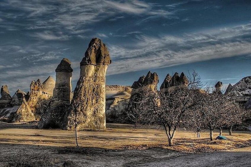 A landscape with rock formations and trees. 4