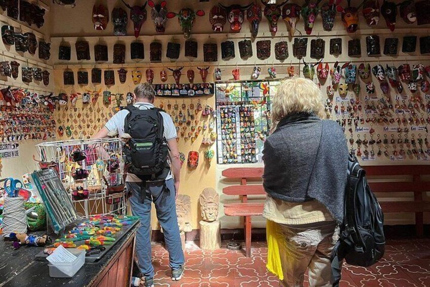 A shop with various masks and trinkets on display. 3