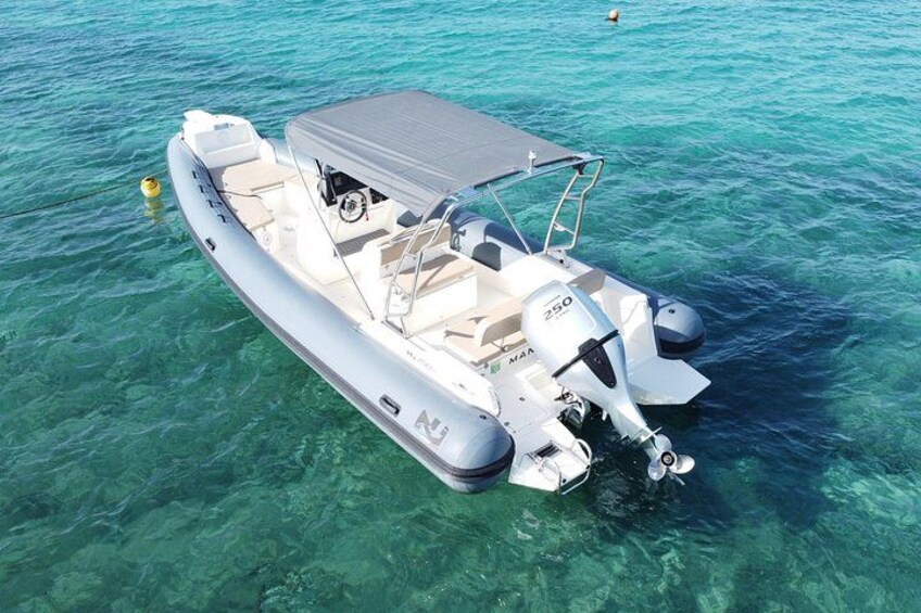 A motorboat on clear turquoise water. 2