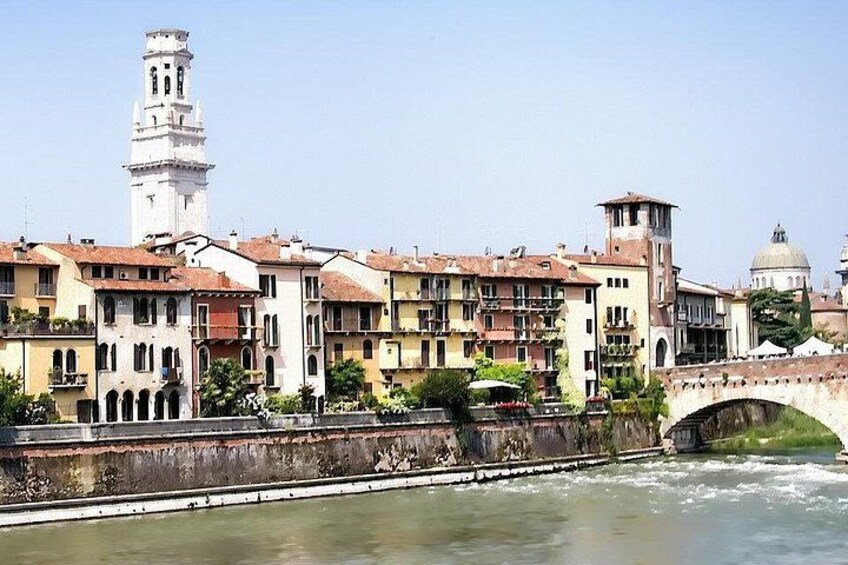A river with buildings and a bridge. 1