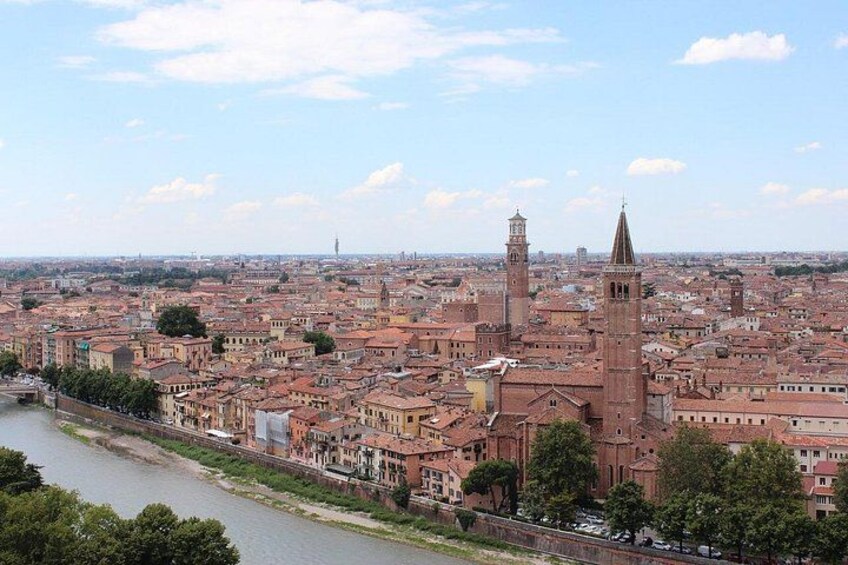 A cityscape with a prominent tower and a river. 3
