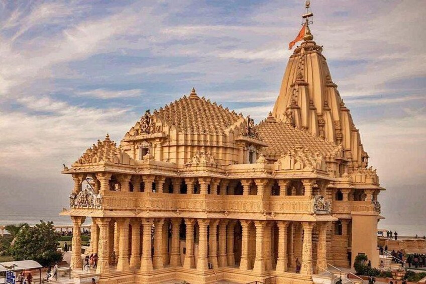A large, intricately carved temple with multiple spires and a flag on top. 5
