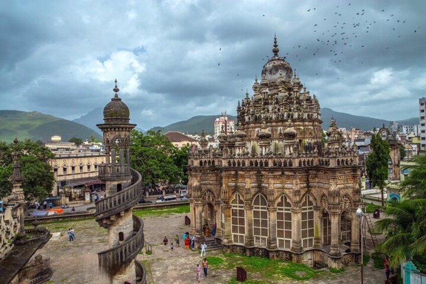 A historic building with intricate architecture, a dome, and a tower. 4