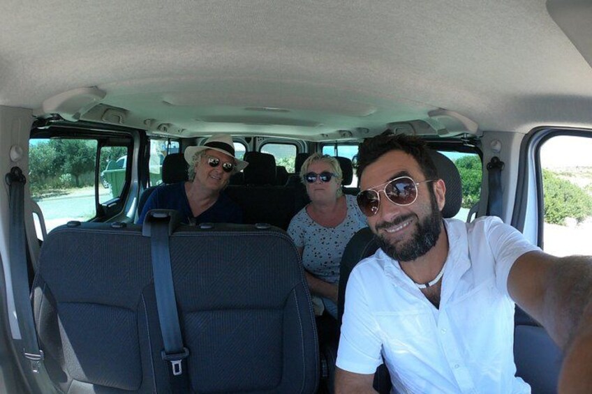 A vehicle interior with four passengers. 2