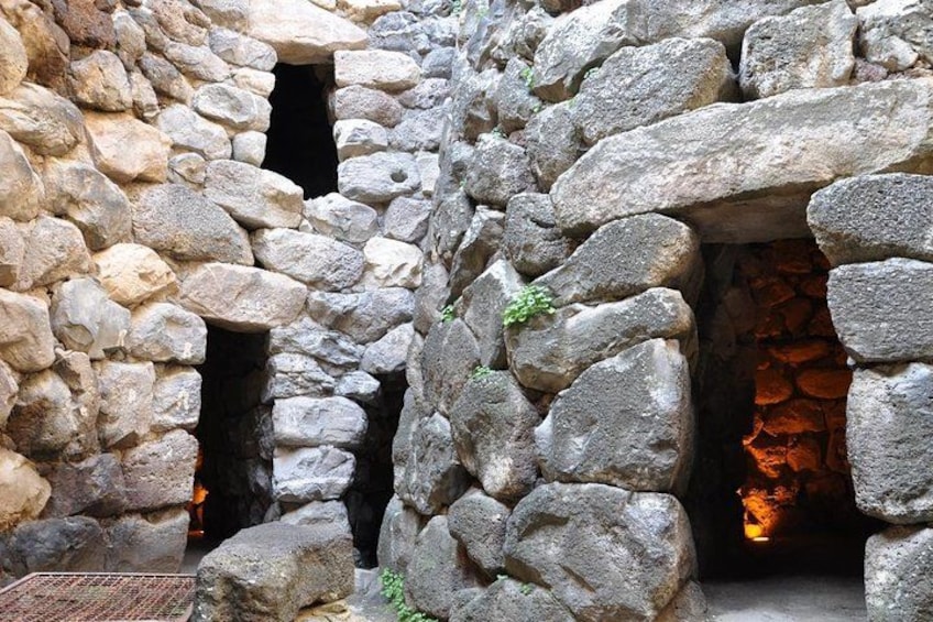 A stone wall with a fireplace. 4