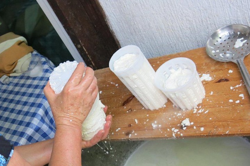 A person peeling a potato. 2