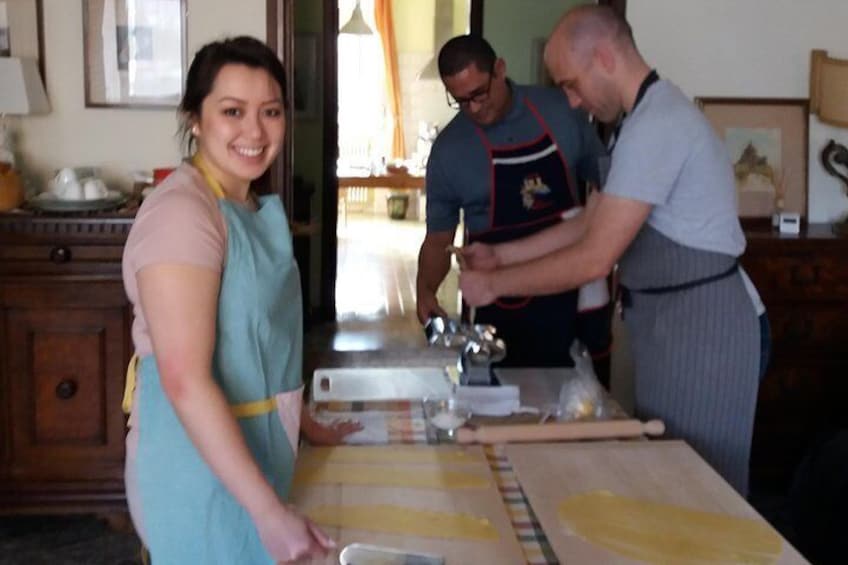 a couple of guests preparing the dough at a safe distance