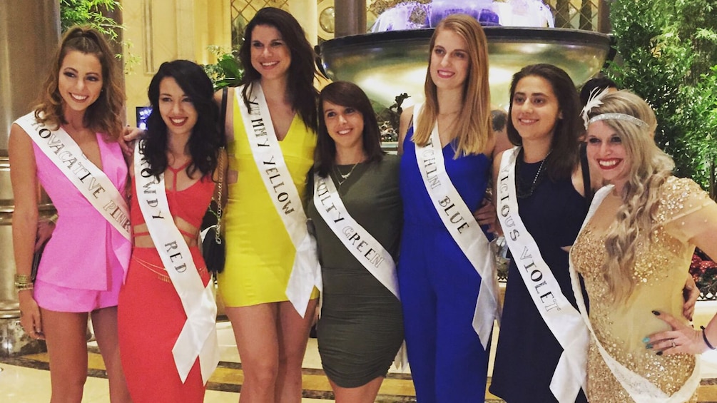 Women dressed up in different colored evening gowns 5