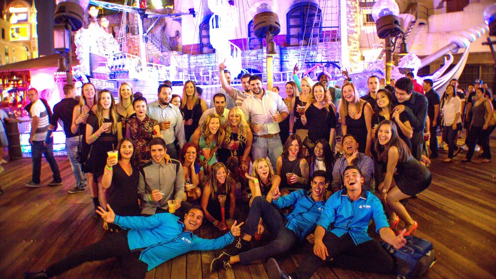 Party group posing in front of Treasure Island 1