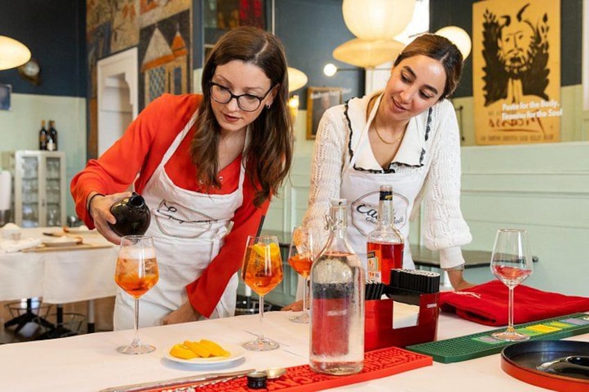 Mixing drinks and and then rolling pasta together. 2
