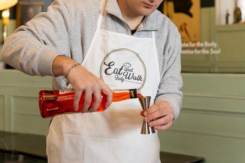 Adding the perfect amount of Aperol. 2