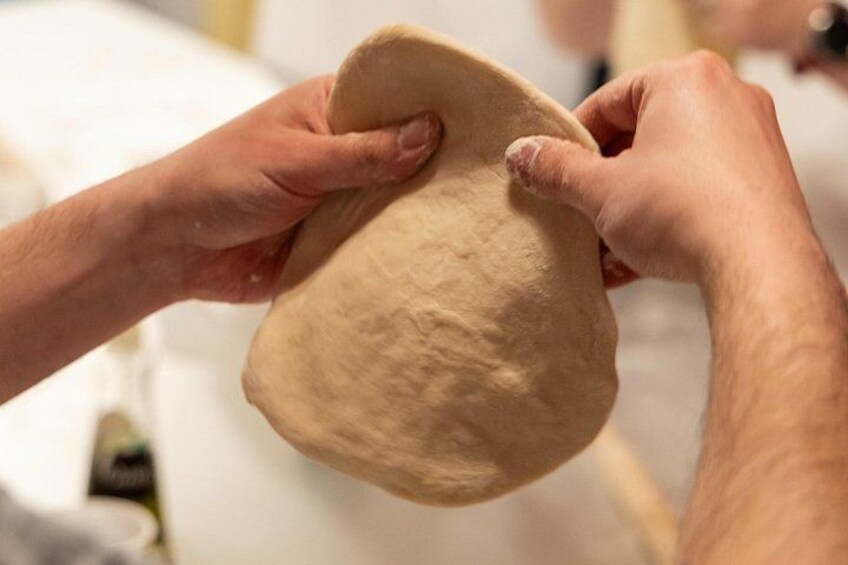 Stretching pizza dough like a pro. 2