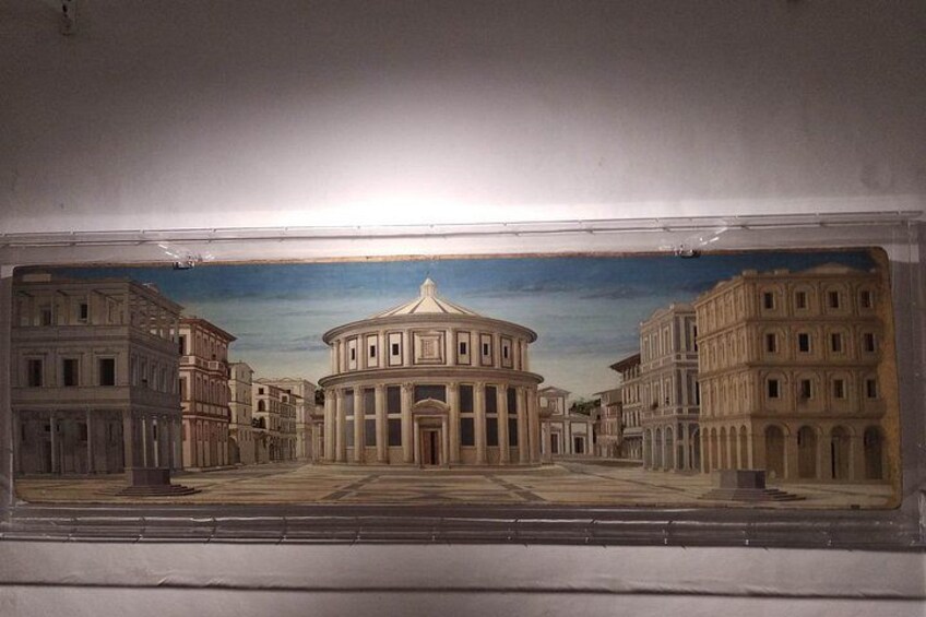 A classical building with columns, a dome, and a square plaza. 3
