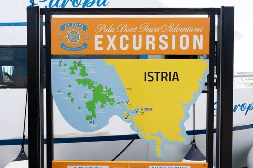 A signboard with a map of Istria, labeled 'EUROPA Pula Boat Tours Adventures EXCURSION.' 2
