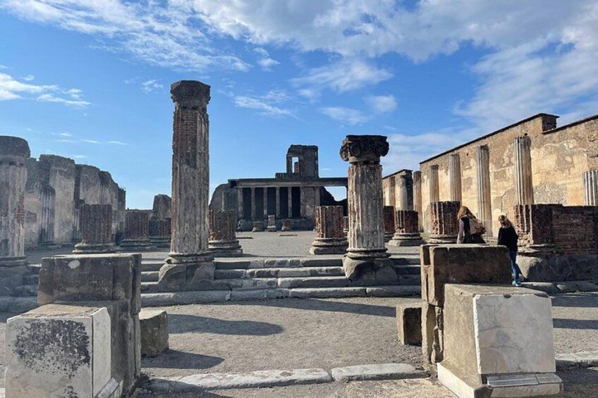 Ancient ruins with columns and stone structures. 1
