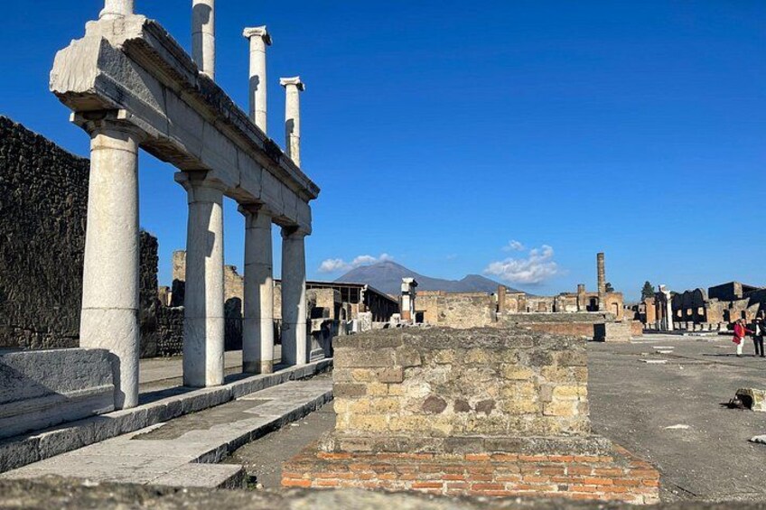 Ancient ruins with columns and stone structures. 4