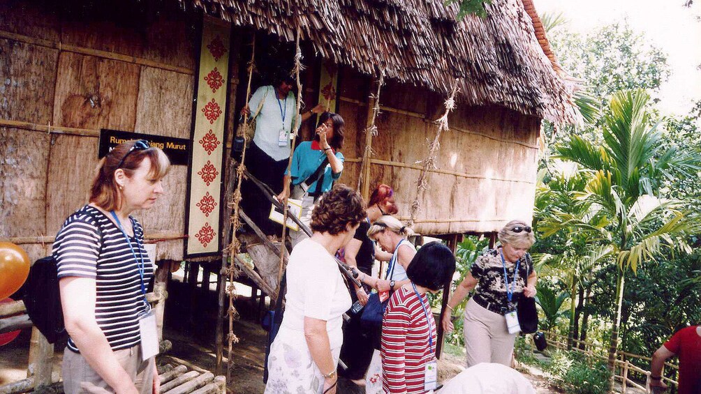 People boarding a wooden boat. 2