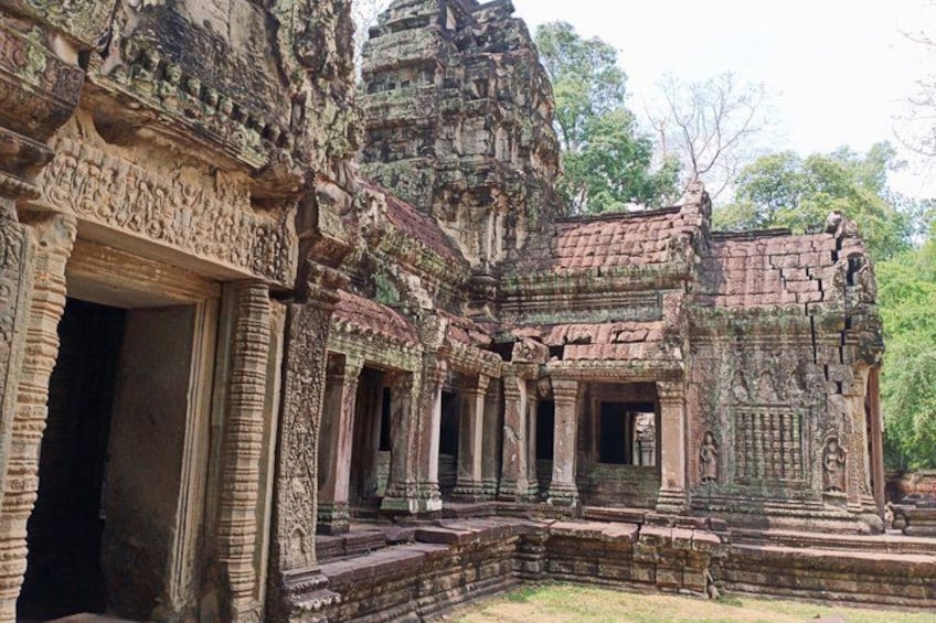 An ancient temple with intricate carvings and a central tower. 2