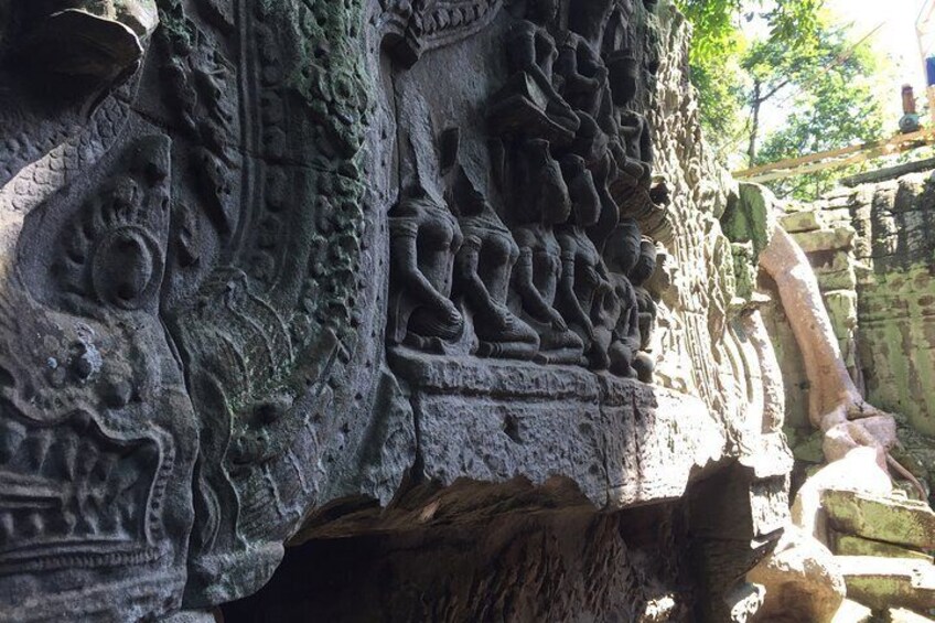 Detailed stone carvings on a temple wall. 5