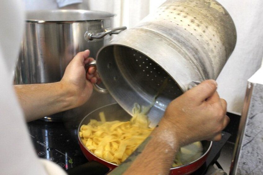 A person pouring a pot into a bowl. 3