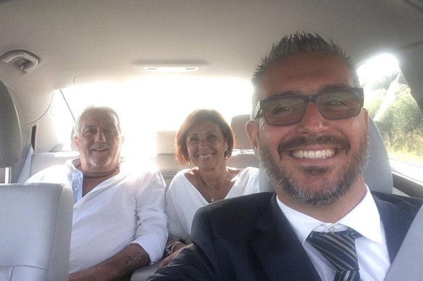 A car interior with three passengers. 5