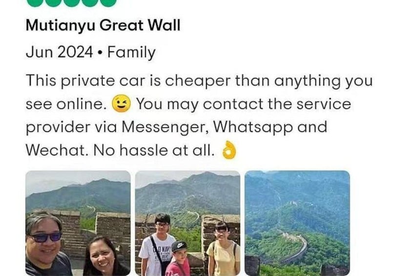 A family at Mutianyu Great Wall, with a view of the wall and surrounding landscape. 3