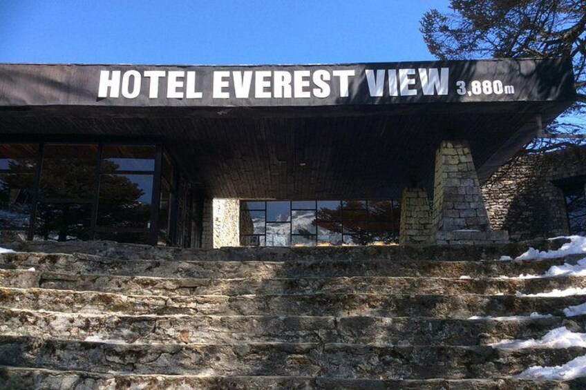 Hotel Everest View with a stone staircase and a sign indicating its elevation at 3,880 meters. 4