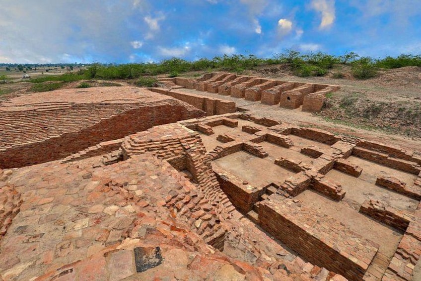Ancient brick ruins with stepped structures and rectangular enclosures. 1