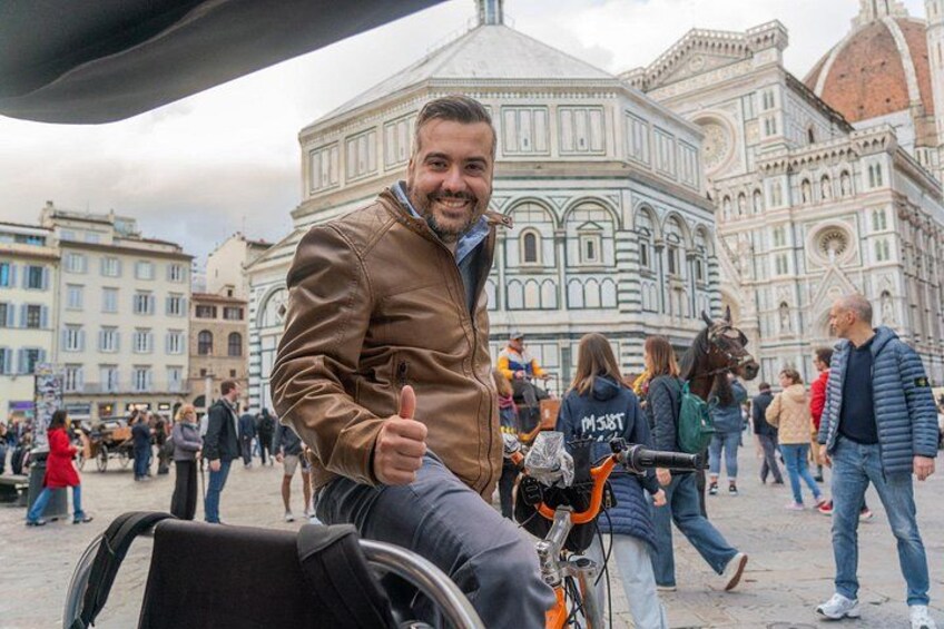 A person giving a thumbs-up gesture in front of a historic building with a dome and intricate architecture. 4