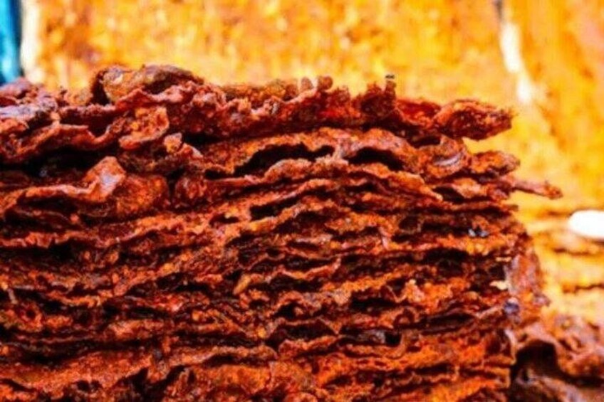 A stack of crispy, reddish-brown fried snacks. 5