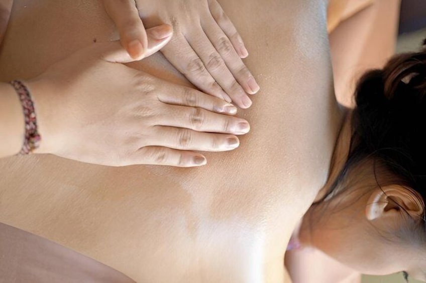 A person receiving a massage on their back. 2