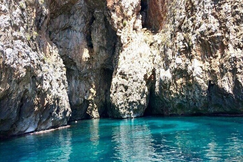 A rocky coastal landscape with clear turquoise water. 5